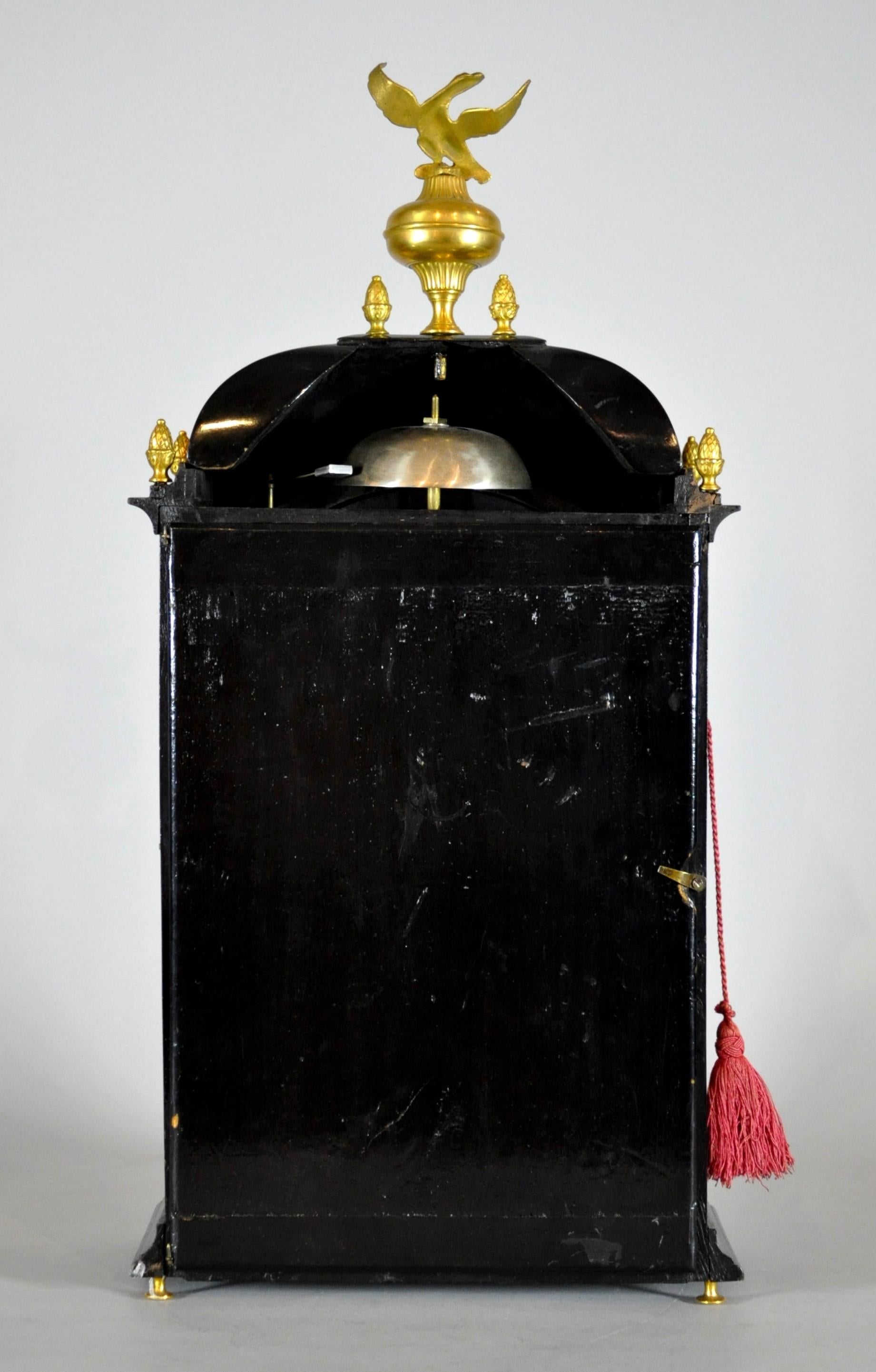 Ebonized Antique Swiss wooden clock with gilt eagle, chime, 1750s era. For Sale
