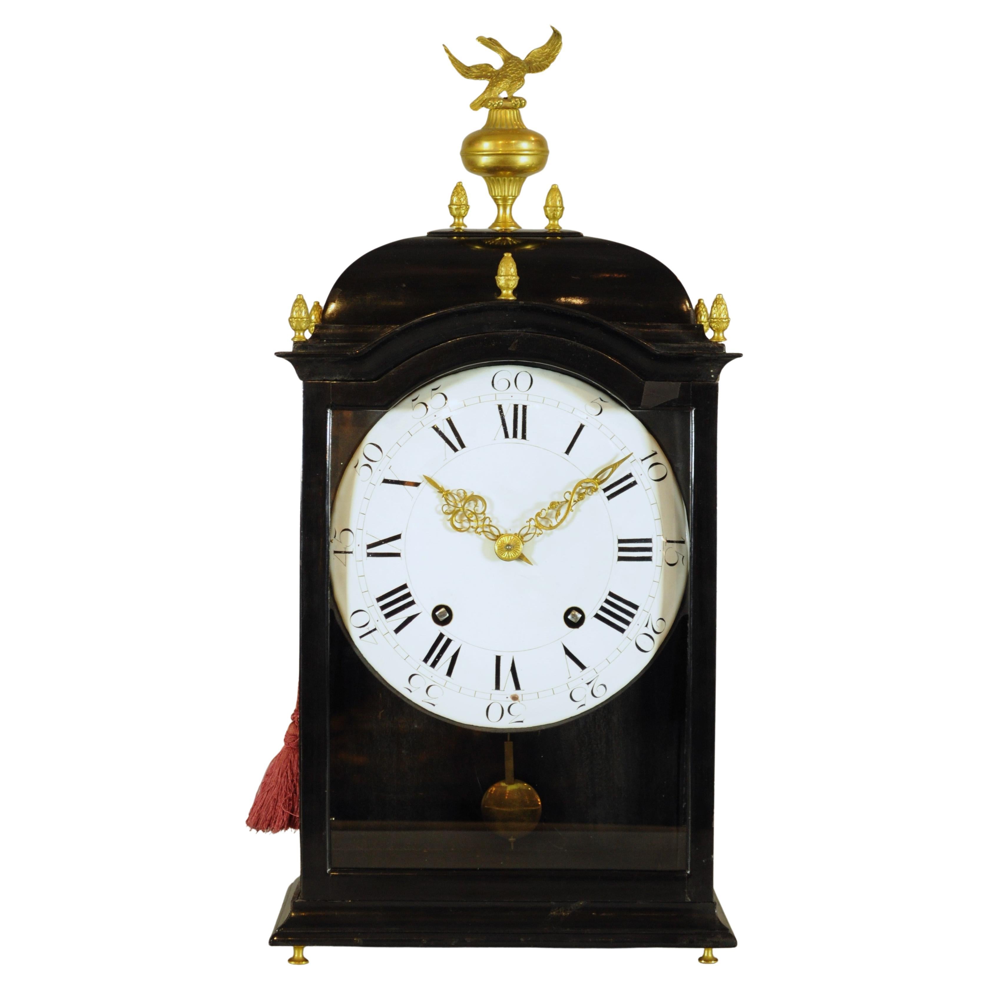 Antique Swiss wooden clock with gilt eagle, chime, 1750s era.