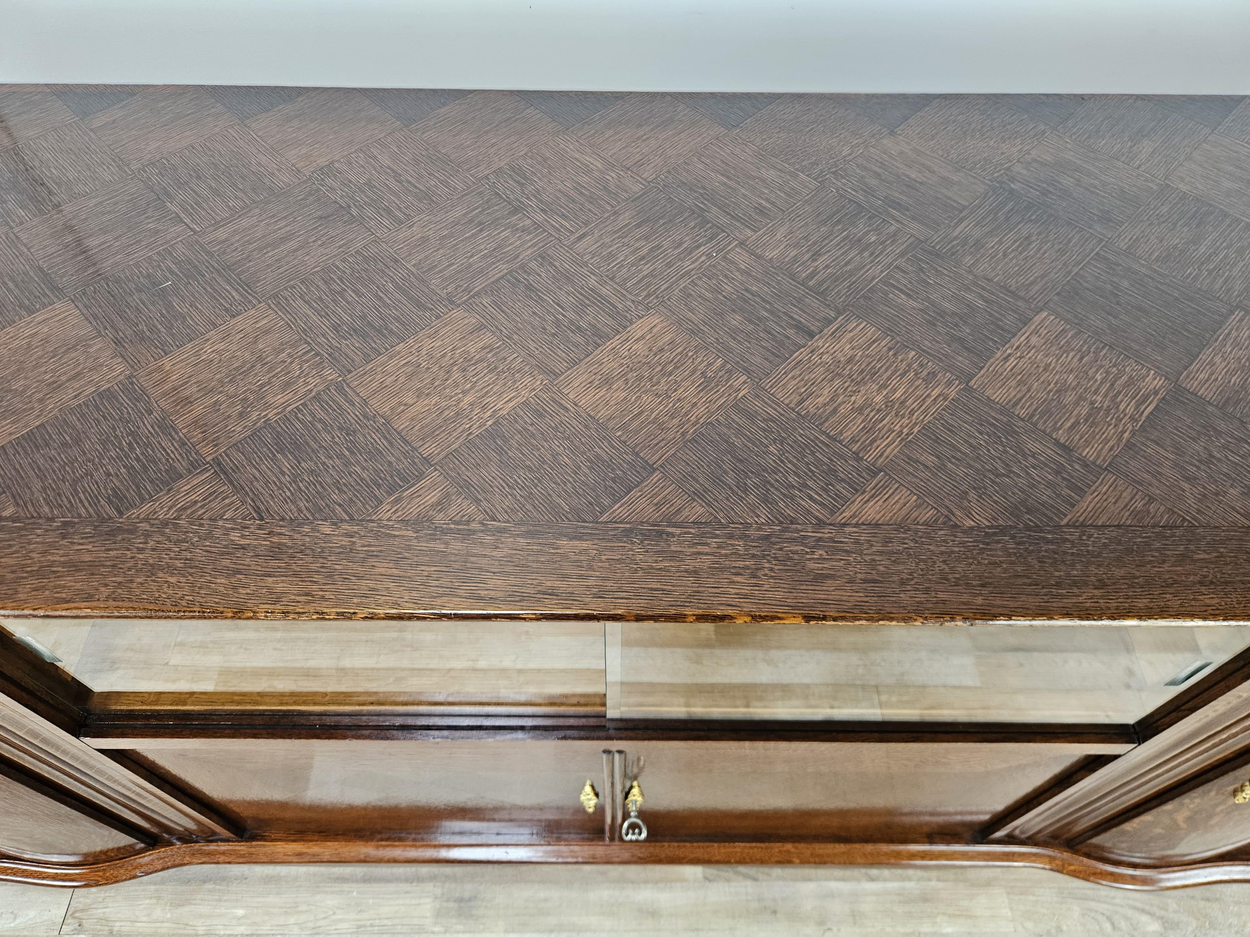 Mid-20th Century Antique Art Deco 1950s oak sideboard with sliding glass and decorations For Sale