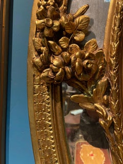 Antica specchiera dorata francese in foglia di oro del 800