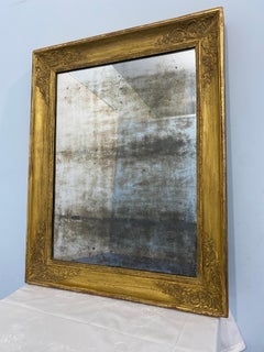 Antica specchiera francese dorata a foglia d'oro epoca Impero 1820