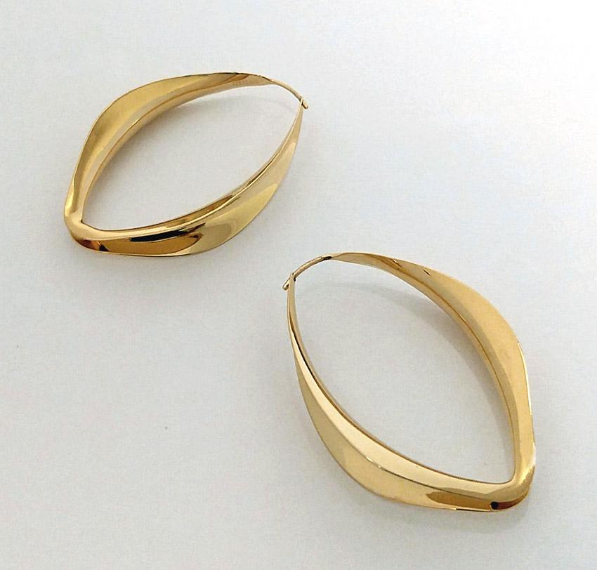 Rare find. These vintage Gerhard Herbst  anticlastic hoops have been in storage since their initial production in the early 1990s. Measuring 2’’ in length and 1 1/4” in width this piece is hand forged from a single piece of sterling material which