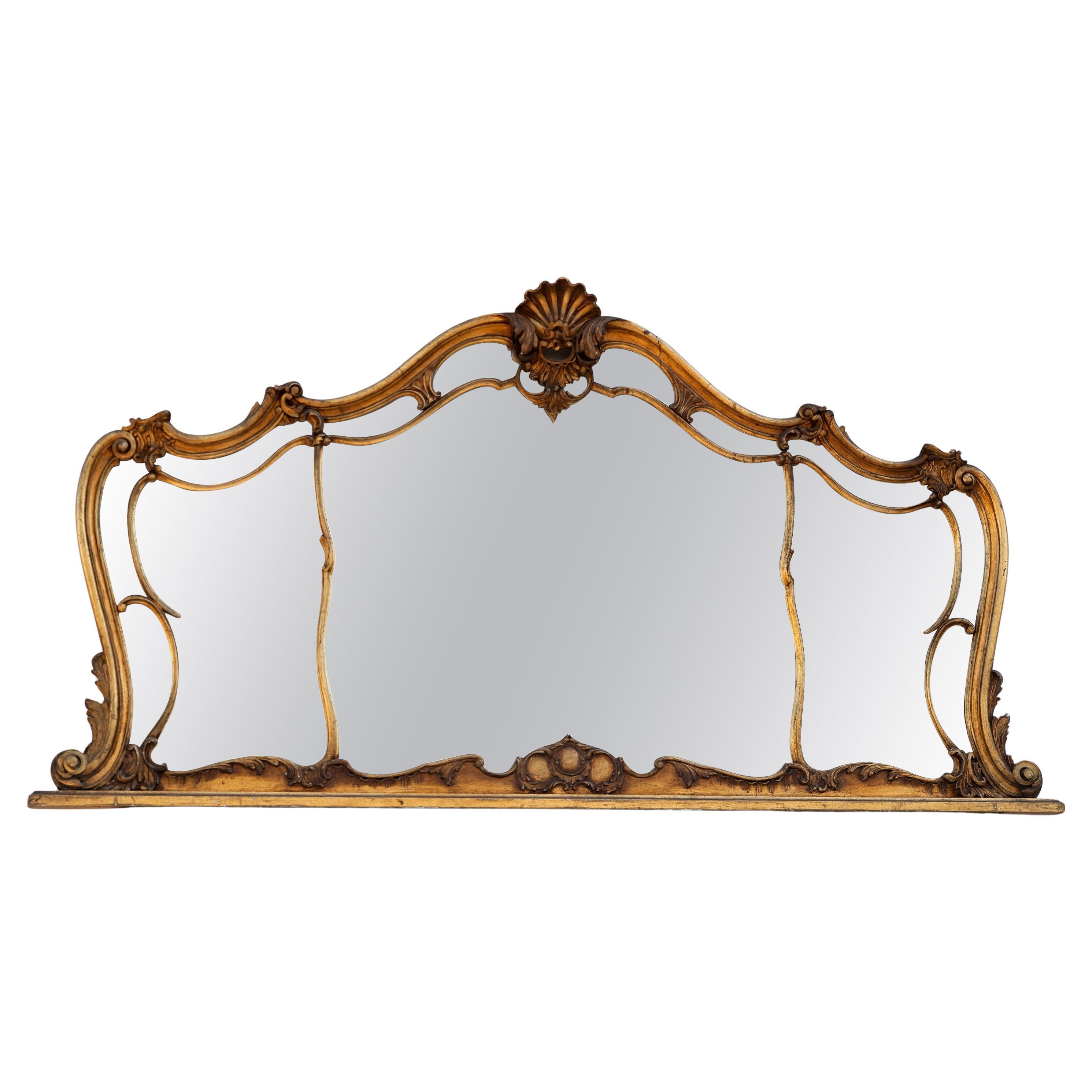 Miroir ancien sculpté et doré, 1900 en vente