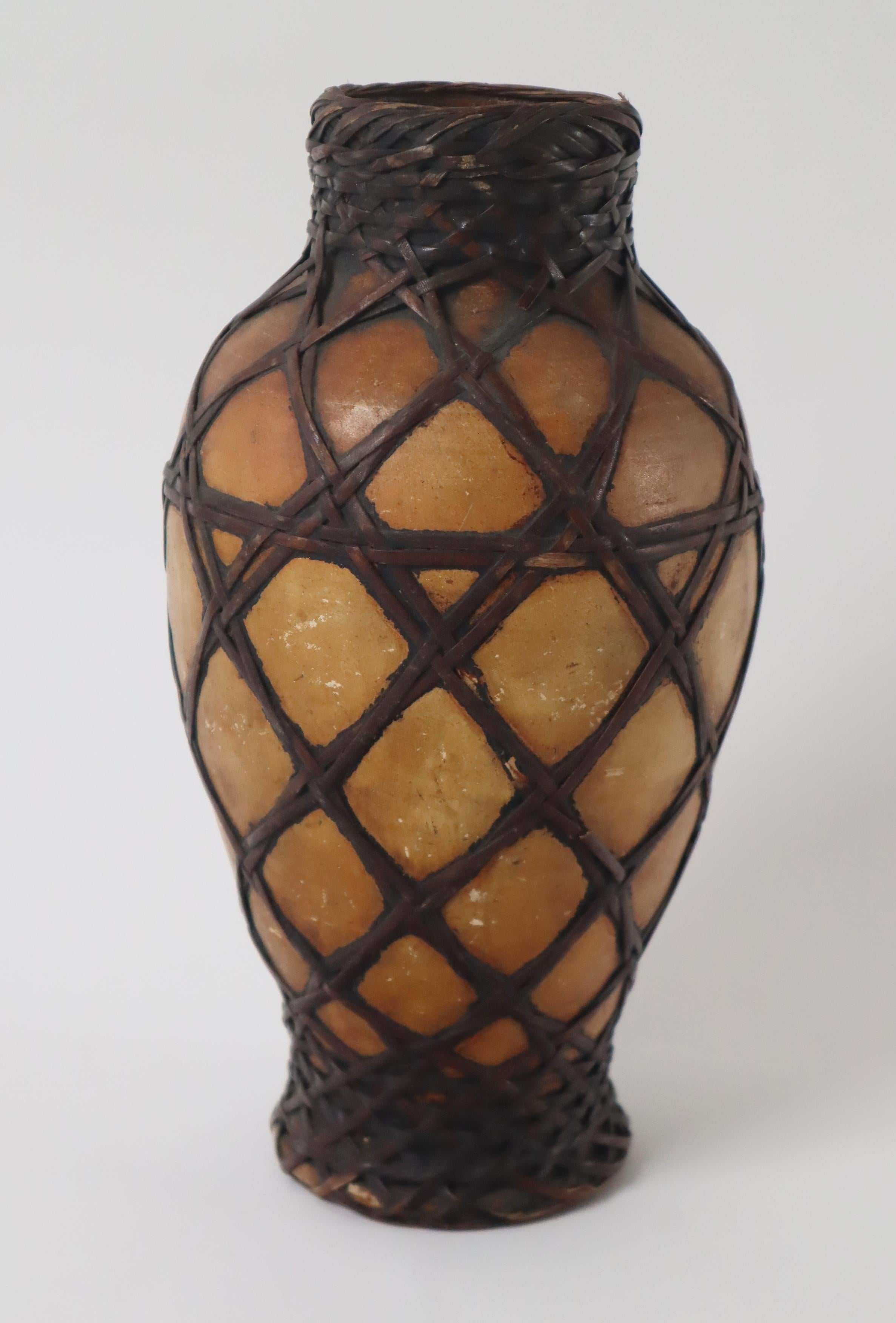 This beautiful vase is hand made and its made in japan. all the materials used to make this vase are natural. one can use this vase to decorate the room in different ways. One can choose to put it just in a room a decoration or put flowers in this