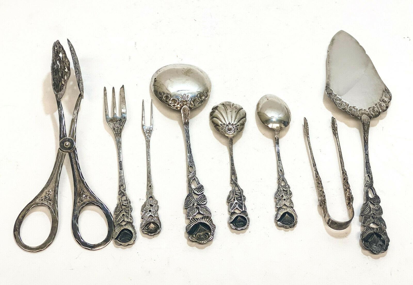 Antiko German 800 Silver 8 Piece Full Dessert flatware service for 12, c. 1960. Beautiful hand chased roses to the handles. Antiko 800 mark to the verso of the handle.

The service includes:
12 Dessert Forks, 12 teaspoons, 2 jam spoons, 2 serving