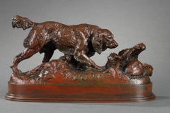 A spaniel pointing a rabbit