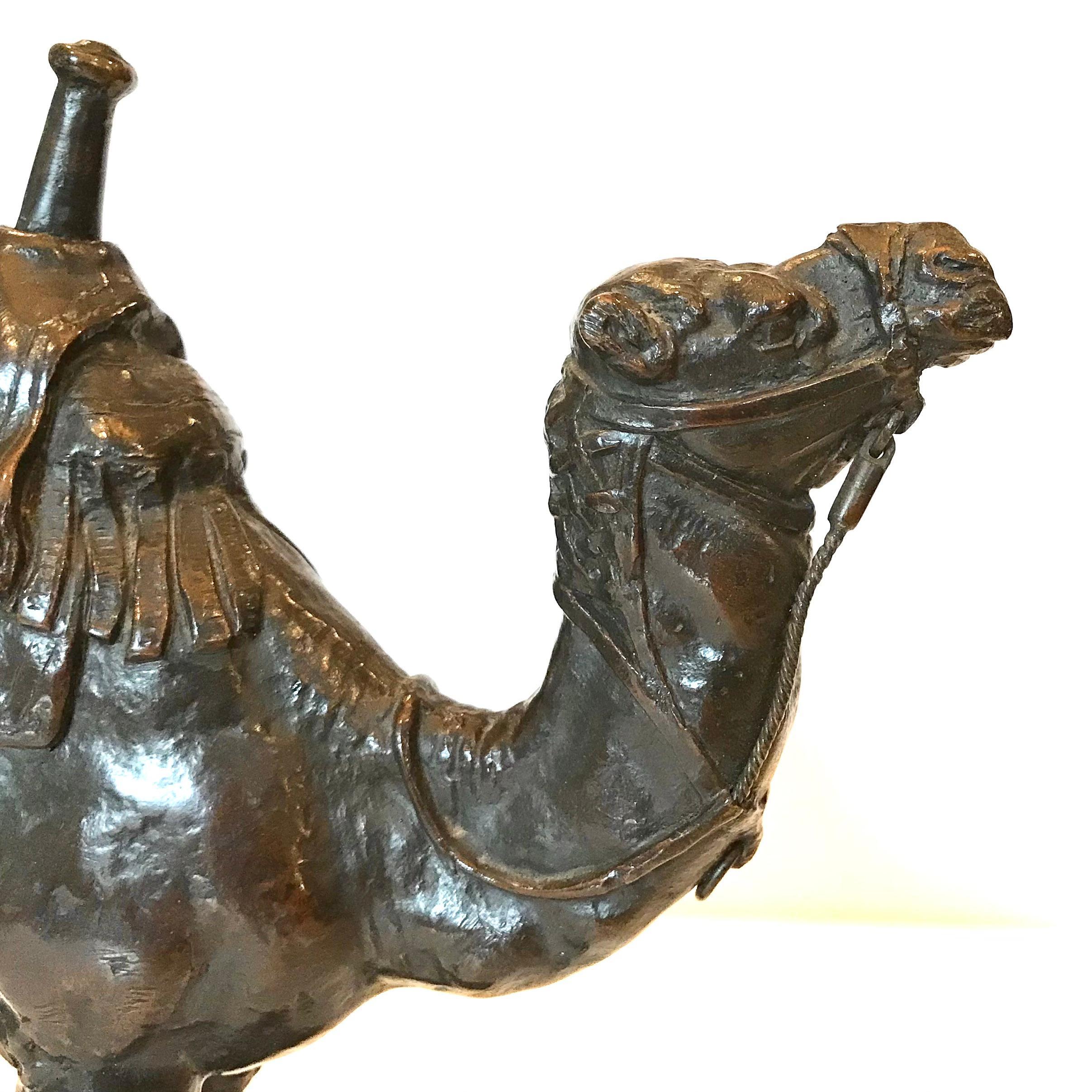 ANTOINE-LOUIS BARYE (FRENCH, 1796-1875): A patinated bronze model of Dromadaire harnaché d'Égypte

Signed 'BARYE' and stamped 'BARYE' by the Brame foundry
Raised on naturalistic base,  

Height: 10 Inches (25cm high)
Length: 10