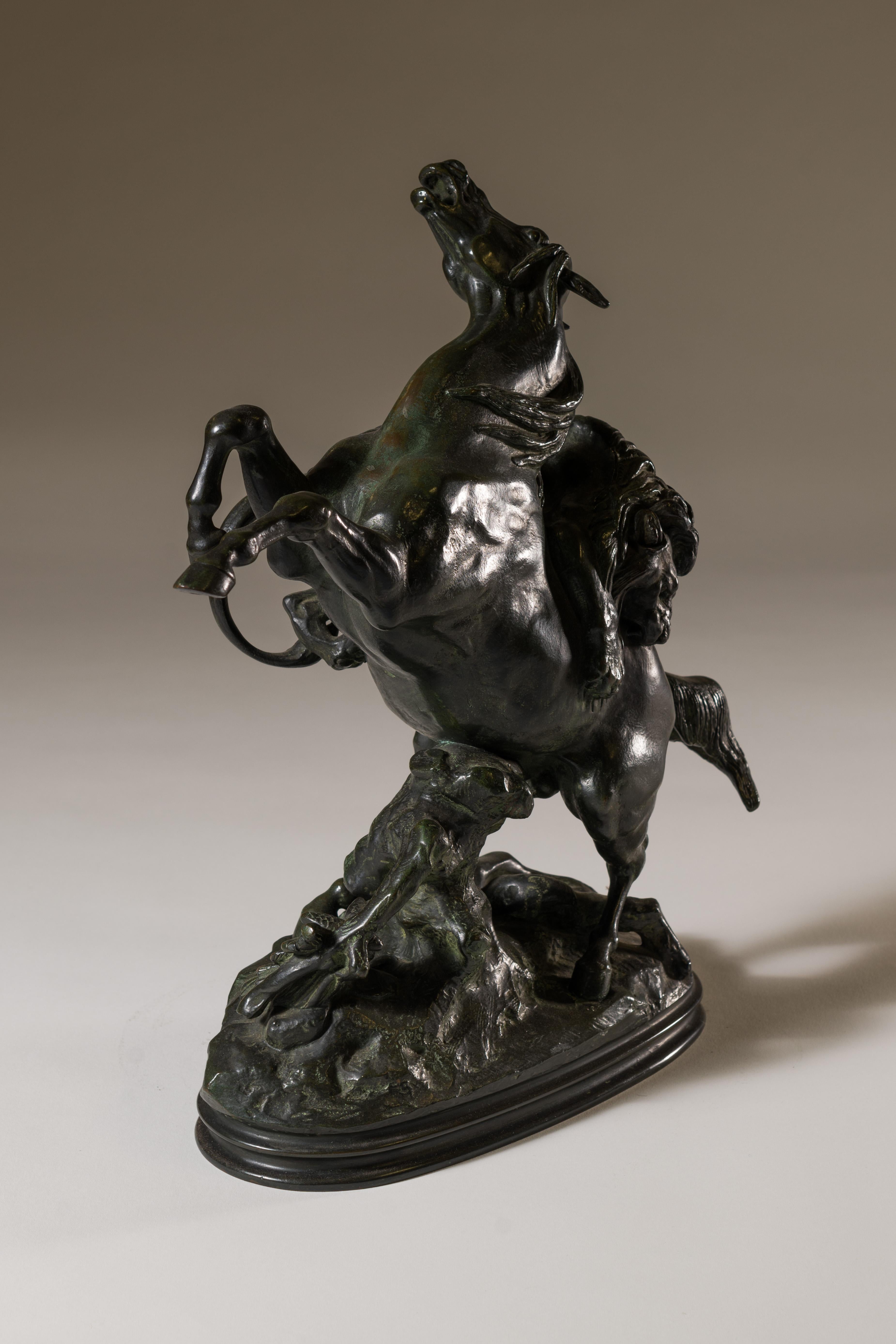 This dynamic bronze done in a green patina is perfect size to grace a table or pedestal. Antoine-Louis Barye was acclaimed  as the finest sculptor of the French Animalier School. As a 19th century sculptor he was an advocate for both naturalism and