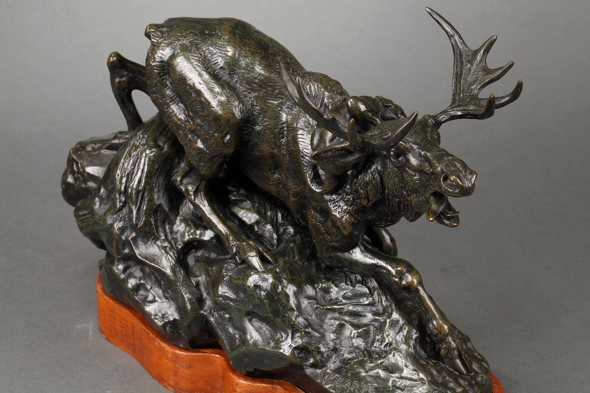 Elk surprised by a Lynx
by Antoine-Louis BARYE (1796-1875)
 
A bronze group with a nuanced dark green patina
Signed on the base 