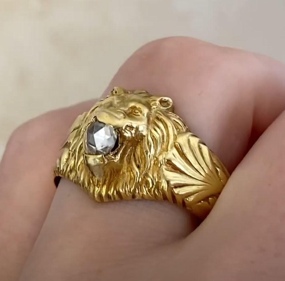 This exquisite antique French ring, dating back to the Art Nouveau era circa 1900, showcases a meticulously sculpted lion’s head with an open mouth, exuding strength and elegance. The intricate craftsmanship is evident in the finely detailed mane