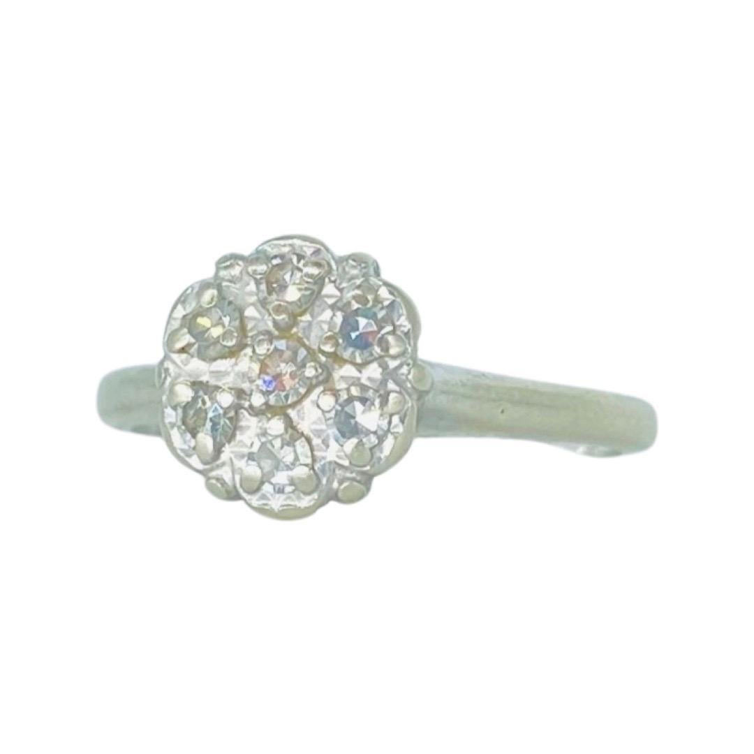 Antique 0.15 Total Carat Weight Single Cut Diamonds Cluster Ring. The ring features 7 single cut diamonds for a total of 0.15 carat. The ring is made of 14k white gold. The ring weights 2.6 grams and is a size 5.75