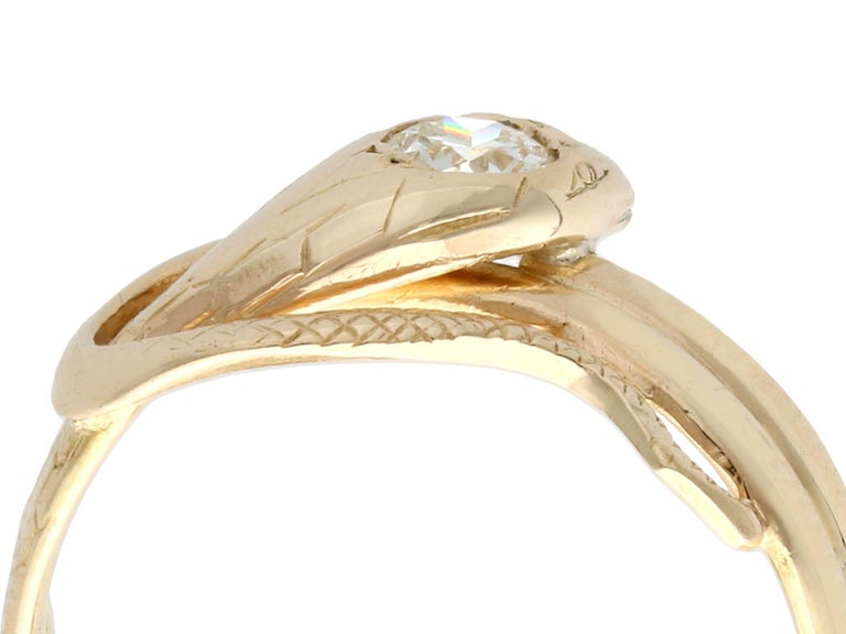 An impressive antique 1900s gent's 0.25 carat diamond and 14 karat yellow gold 'snake' ring; part of our diverse antique jewelry and estate jewelry collections.

This fine and impressive antique gold ring has been crafted in 14k yellow gold.

The
