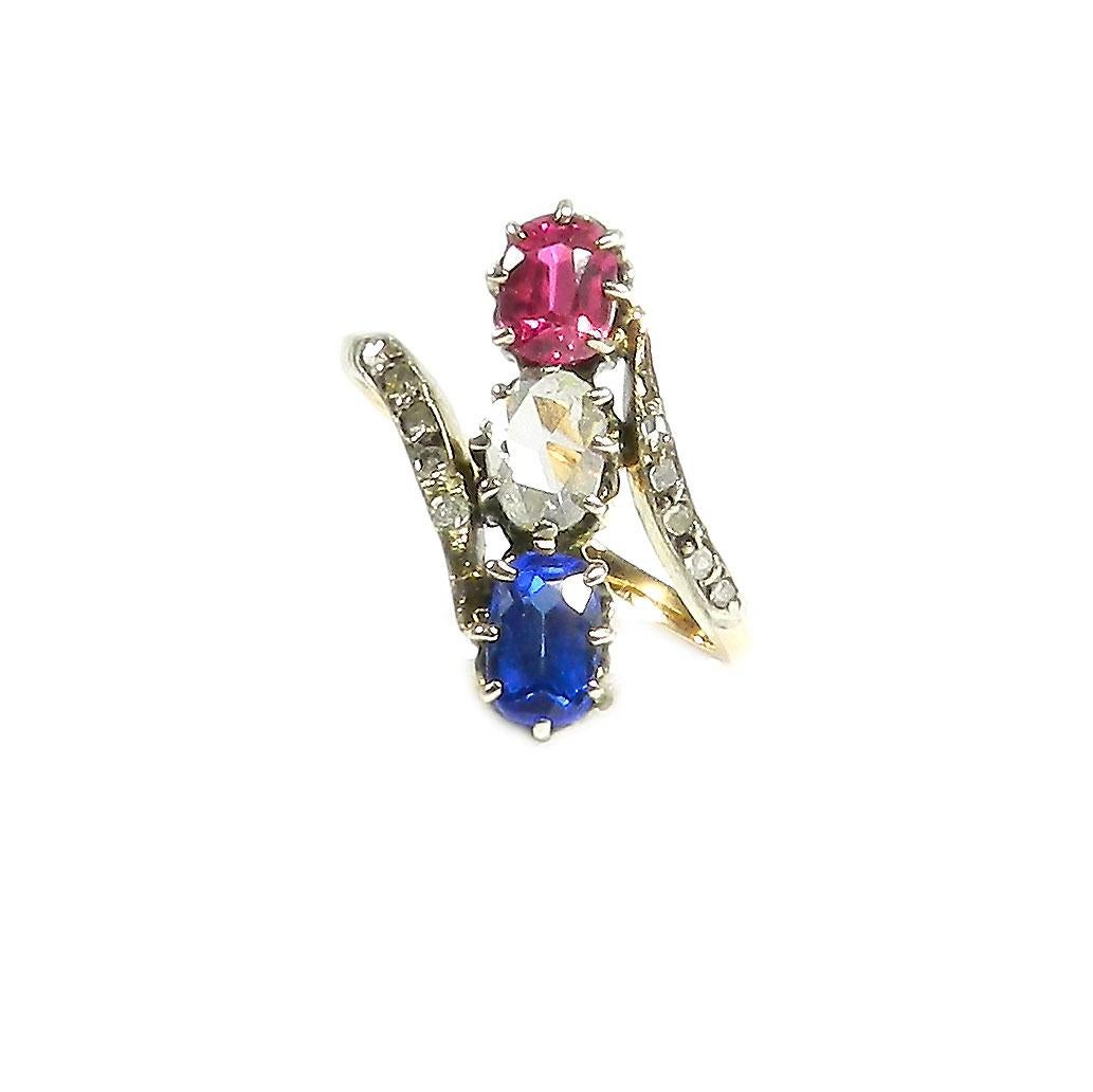 Oval Cut Antique 0.25 Carat Diamond Ruby and Sapphire Three Stone Gold Ring, circa 1890