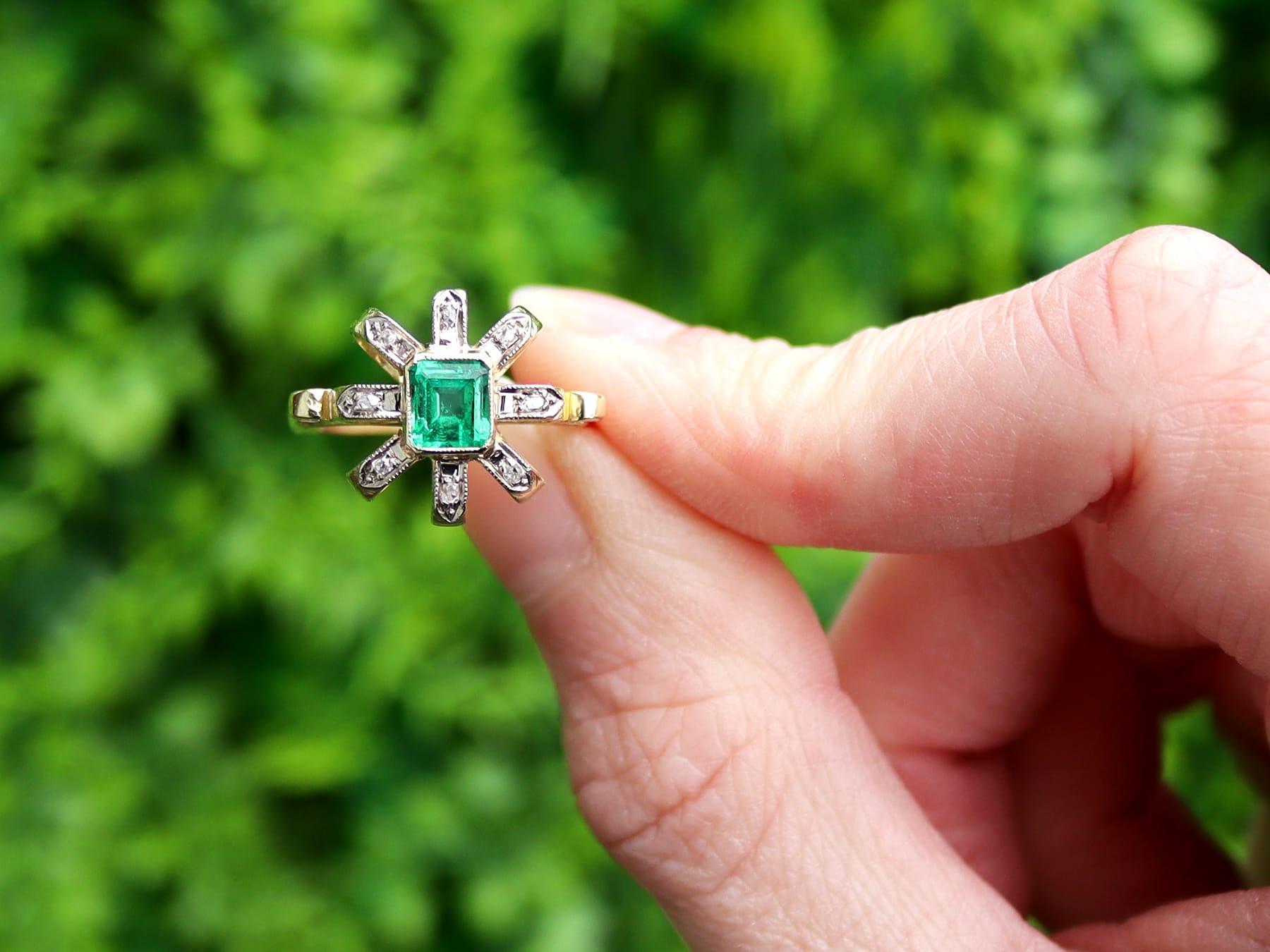 A stunning, fine and impressive antique 0.32 carat emerald and 0.08 carat diamond, 15 karat yellow gold and silver set ring; part of our antique emerald jewelry collection.

This stunning, fine and impressive antique 1920s emerald ring has been