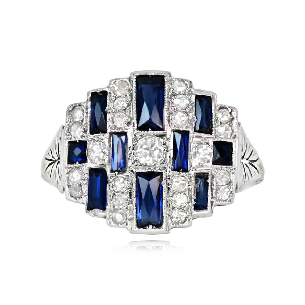 An antique Art Deco ring featuring a central old mine-cut diamond with a geometric arrangement of single-cut diamonds and French-cut synthetic sapphires. The ring has a total diamond weight of about 0.35 carats, with diamonds of I-J color and