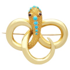 Antique 0.37 Carat Turquoise and Garnet Yellow Gold Snake Brooch