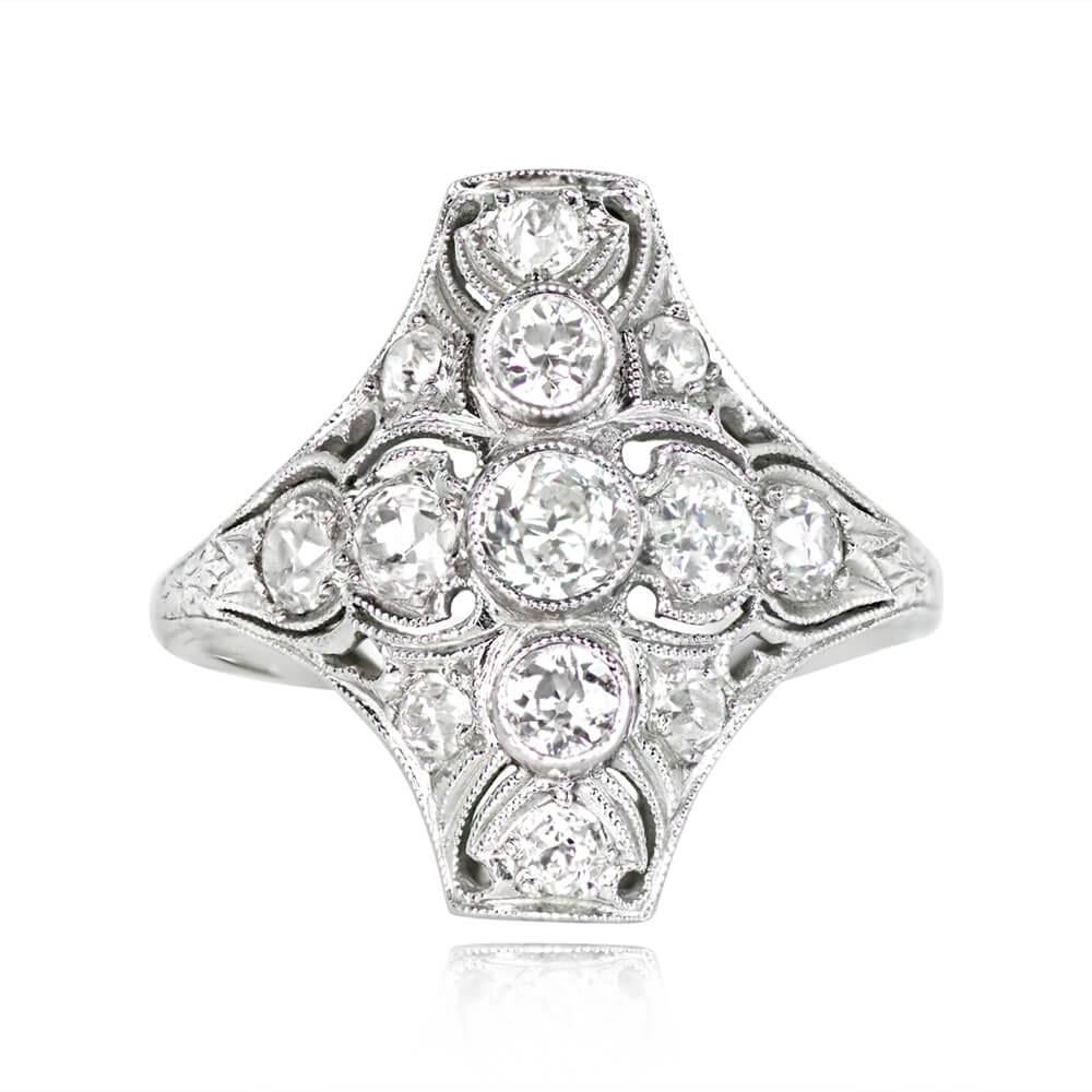 An antique elongated ring showcases three old European cut diamonds weighing approximately 0.40 carats in a north-south arrangement. Adding elegance, four more old European cut diamonds adorn the shoulders in an east-west layout, accompanied by