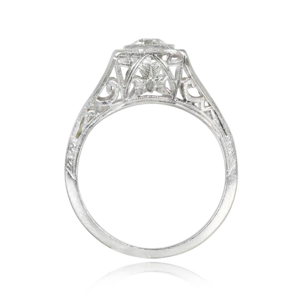An Art Deco diamond engagement ring showcasing a 0.40-carat old European cut diamond, I color, and VS2 clarity. Set in prongs within a square bezel, the ring displays a geometric open-work design on the under-gallery and shoulders. Crafted in