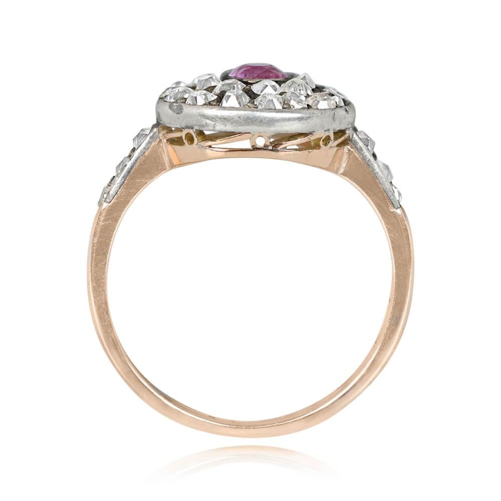 Antique Pink Sapphire Ring: A Victorian-era masterpiece circa 1870. This ring showcases a 0.40-carat oval cut pink sapphire, embraced by a double halo of old mine-cut diamonds. Diamond-adorned shoulders enhance its beauty, with a total diamond