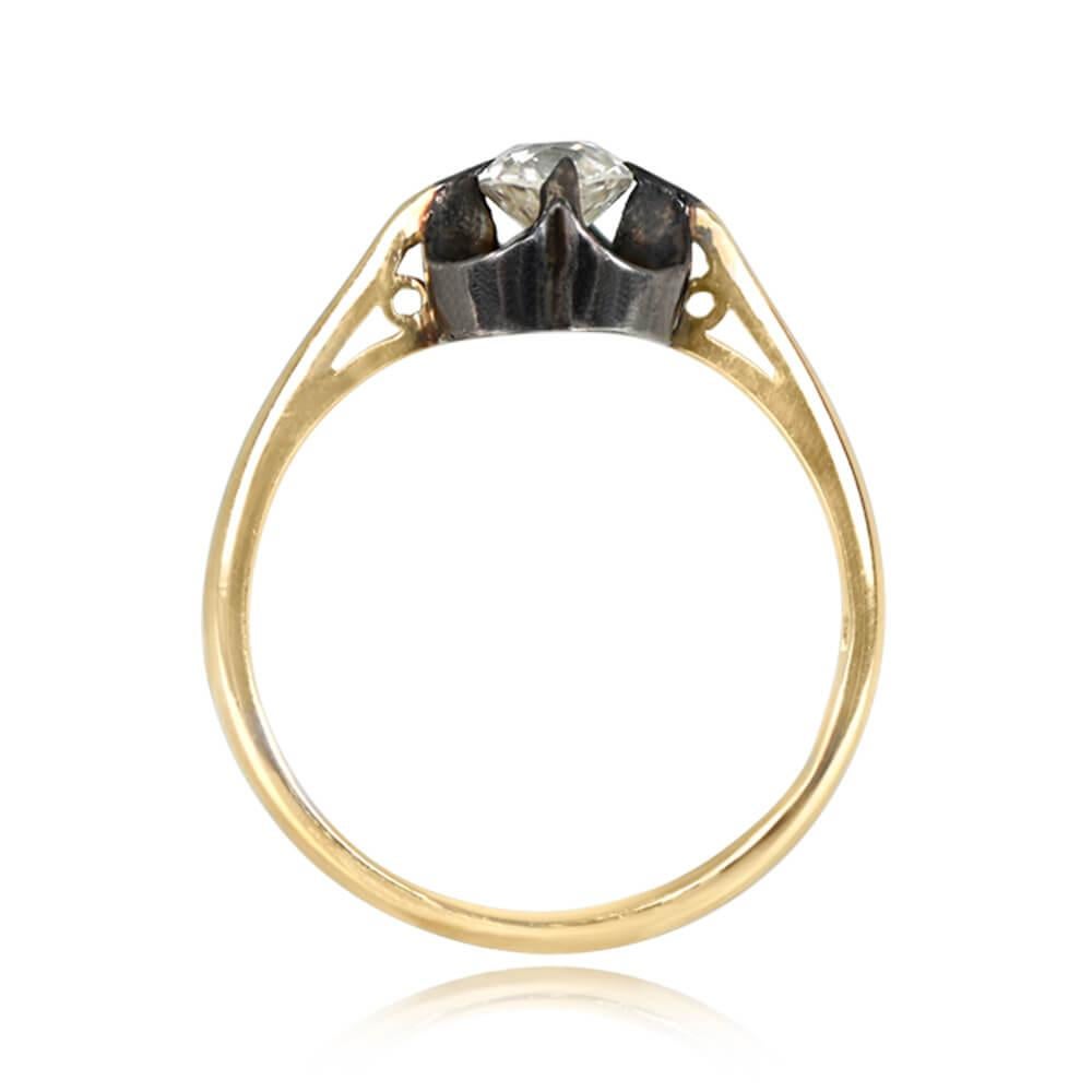 Antique Diamond Solitaire: This engagement ring showcases a charming 0.42-carat antique cushion cut diamond, J color, and SI1 clarity, set securely in prongs. The diamond resides within a silver basket atop an 18k yellow-gold band. Crafted during