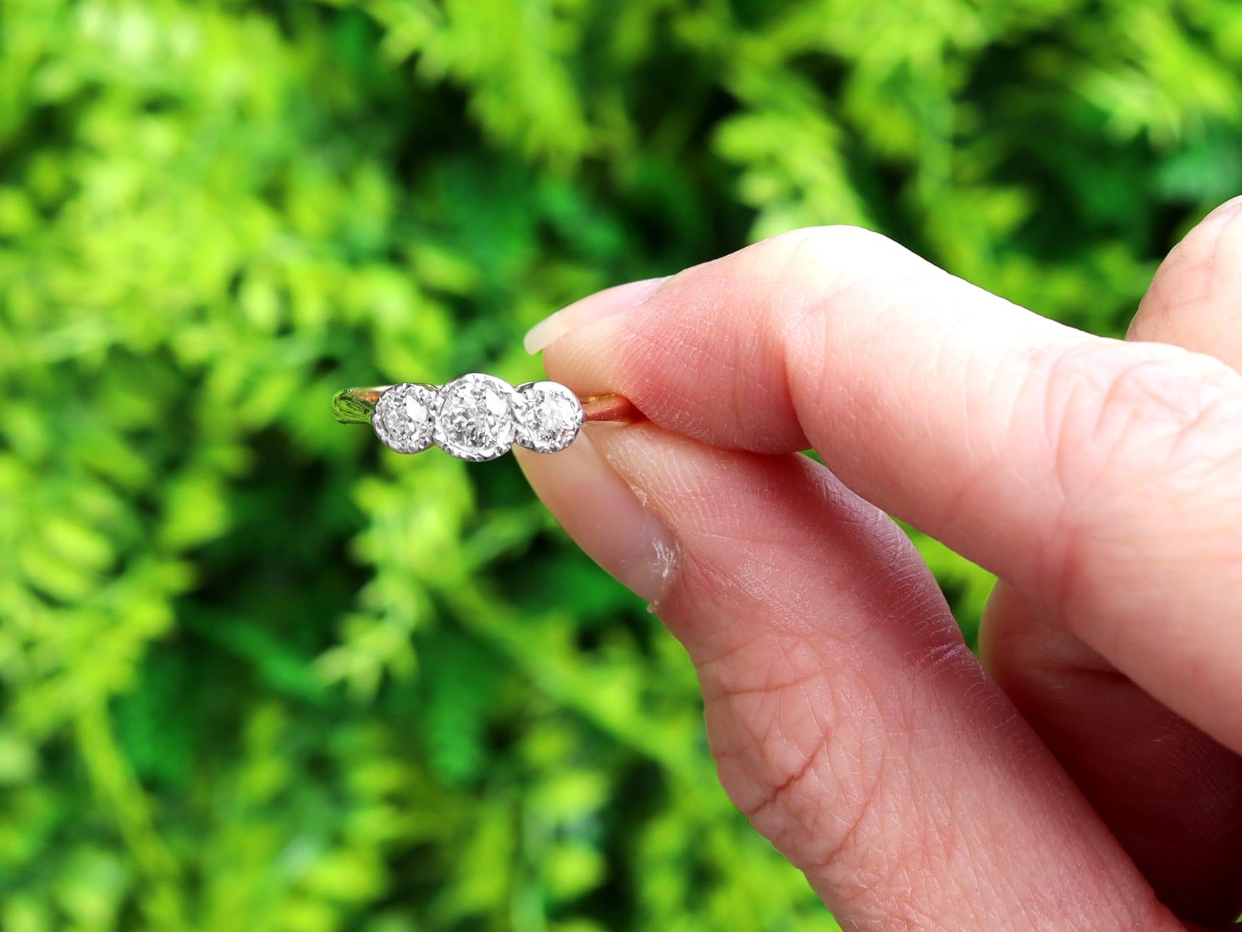 A fine and impressive antique 0.46 carat diamond and 18 karat yellow gold, platinum set trilogy ring; part of our diamond trilogy rings collection.

This fine and impressive antique gold trilogy ring has been crafted in 18k yellow gold with a