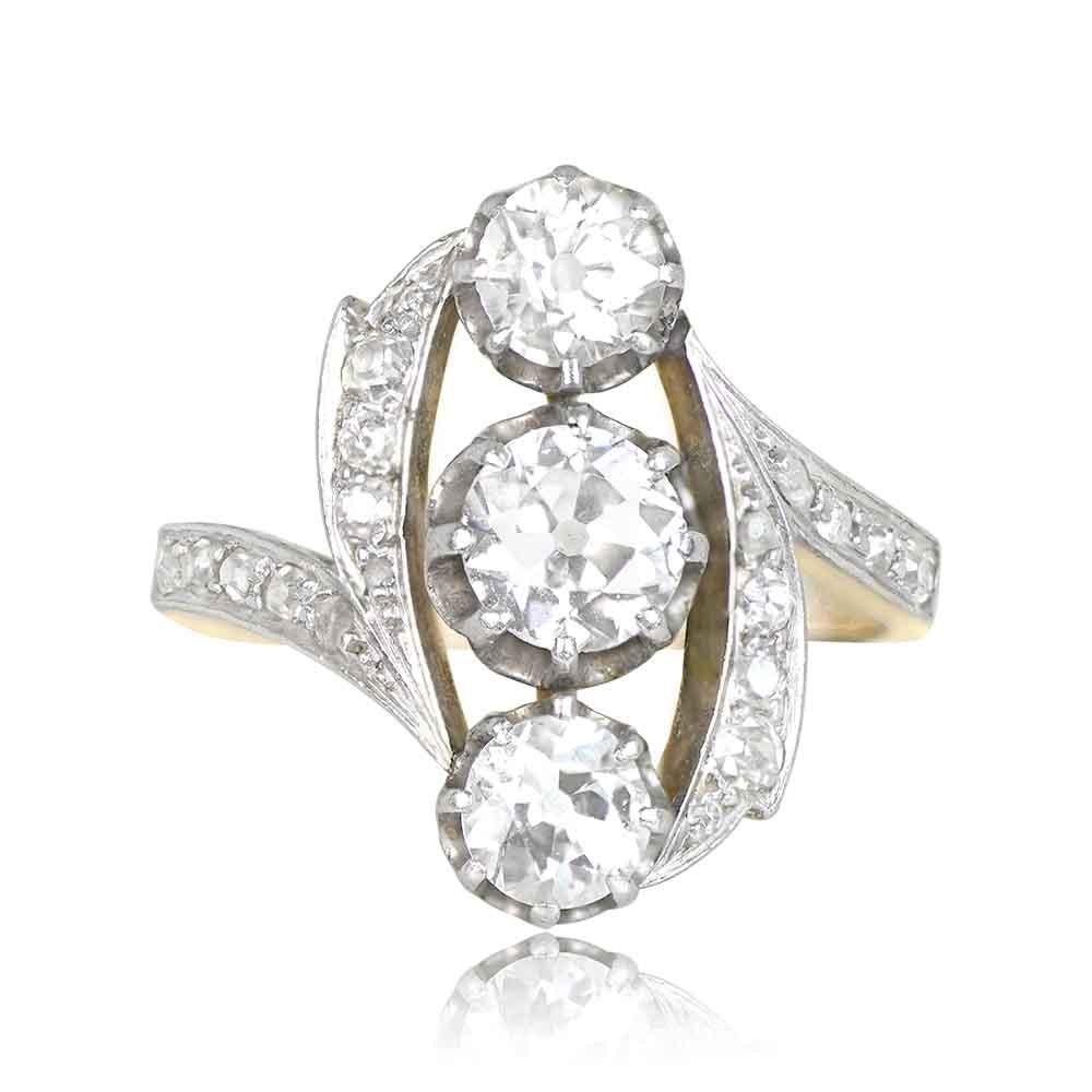 This captivating antique diamond ring showcases three diamonds with a combined weight of approximately 1 carat. The central piece is a 0.50-carat old European cut diamond, flanked by two single-cut diamonds, each positioned above and below. The old