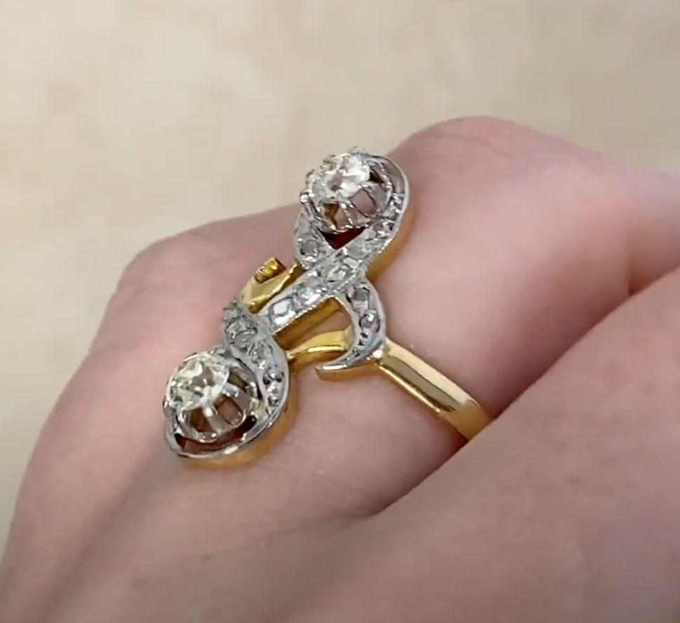 This exquisite antique Edwardian two-stone ring showcases a pair of captivating old European cut diamonds, with a combined weight of approximately 0.5-carats. Graded as K color with SI1 clarity, these diamonds exhibit the timeless charm and