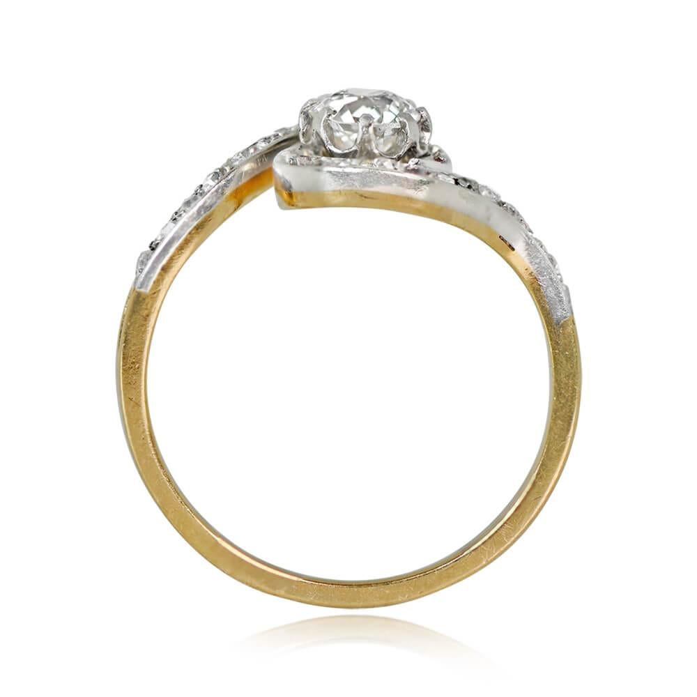 An Edwardian antique engagement ring showcasing a 0.55-carat old European cut diamond, I color, SI2 clarity, set in prongs. The center stone is encircled by a swirling halo of rose-cut diamonds, totaling around 0.16 carats. Crafted in platinum on