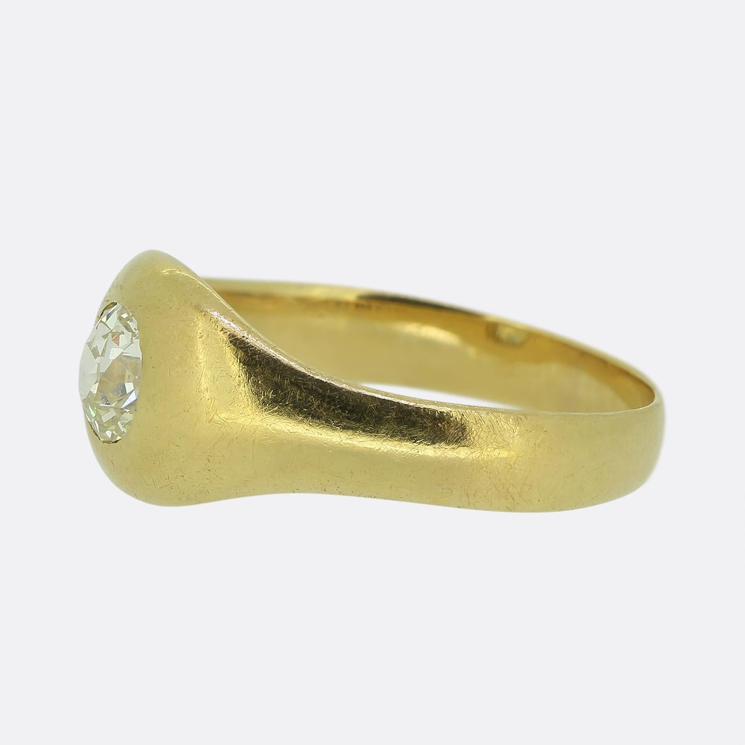 Here we have a delightful diamond gypsy ring crafted from a rich 18ct yellow gold. At the centre, we find a single round faceted old European-cut diamond boasting a captivating white hue. The diamond is securely nestled within a smooth mount,