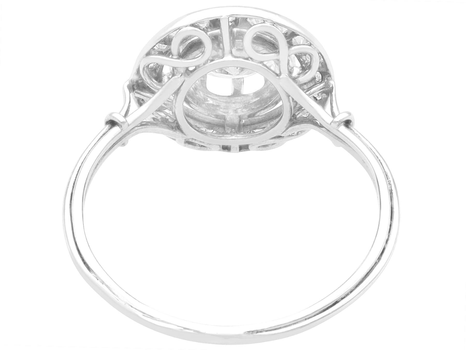 Round Cut Antique 0.63 Carat Diamond and Platinum Cluster Ring For Sale
