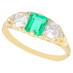 Antique 0.64 carat Emerald 0.79 carat Diamond 18k Yellow Gold Trilogy Ring
