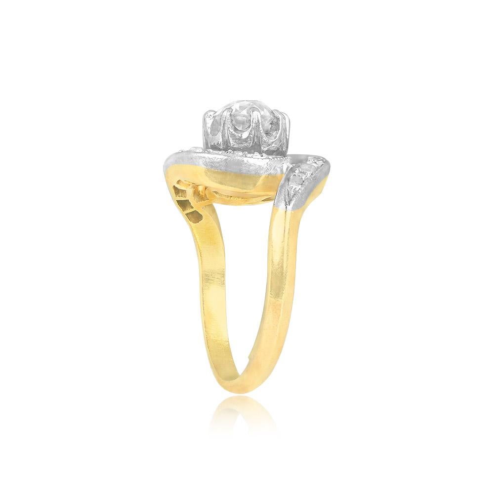 This exquisite antique swirl ring is a testament to the refined artistry of the Edwardian era, dating back to approximately 1900. The centerpiece of this handcrafted ring is a stunning old European-cut diamond, weighing approx. 0.60-carats, graded H