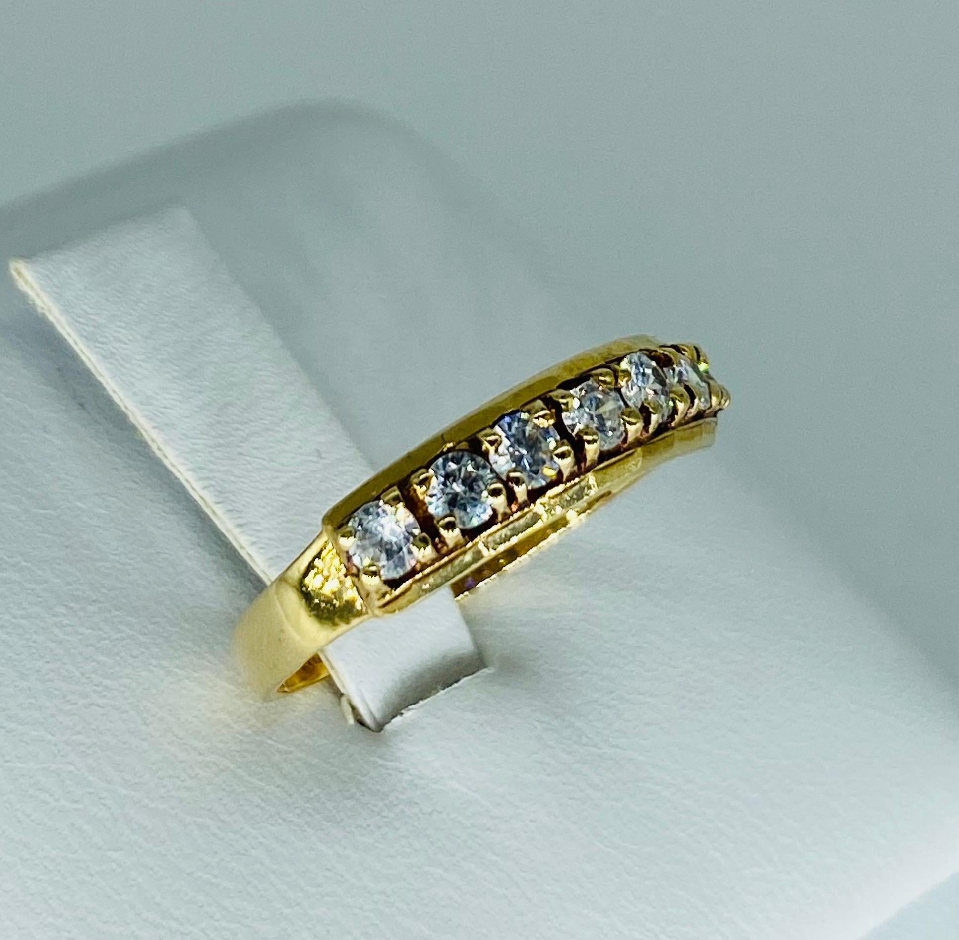 Antique 0.70 Carat Diamond Half Eternity Ring m. Beautiful ring featuring 7 diamonds totaling 0.70 carat approx. the ring is a size 6.5 and weights 2.2 grams 14k solid gold.