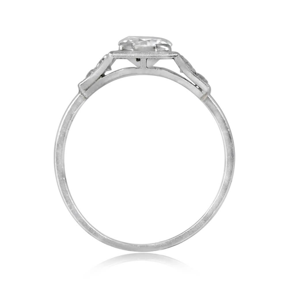 An antique engagement ring showcasing a 0.70-carat old European cut diamond, H color, and SI1 clarity, set in box prongs. The tapered shoulders display around 0.09 carats of single-cut diamonds and elegant fine milgrain details. Crafted in platinum,