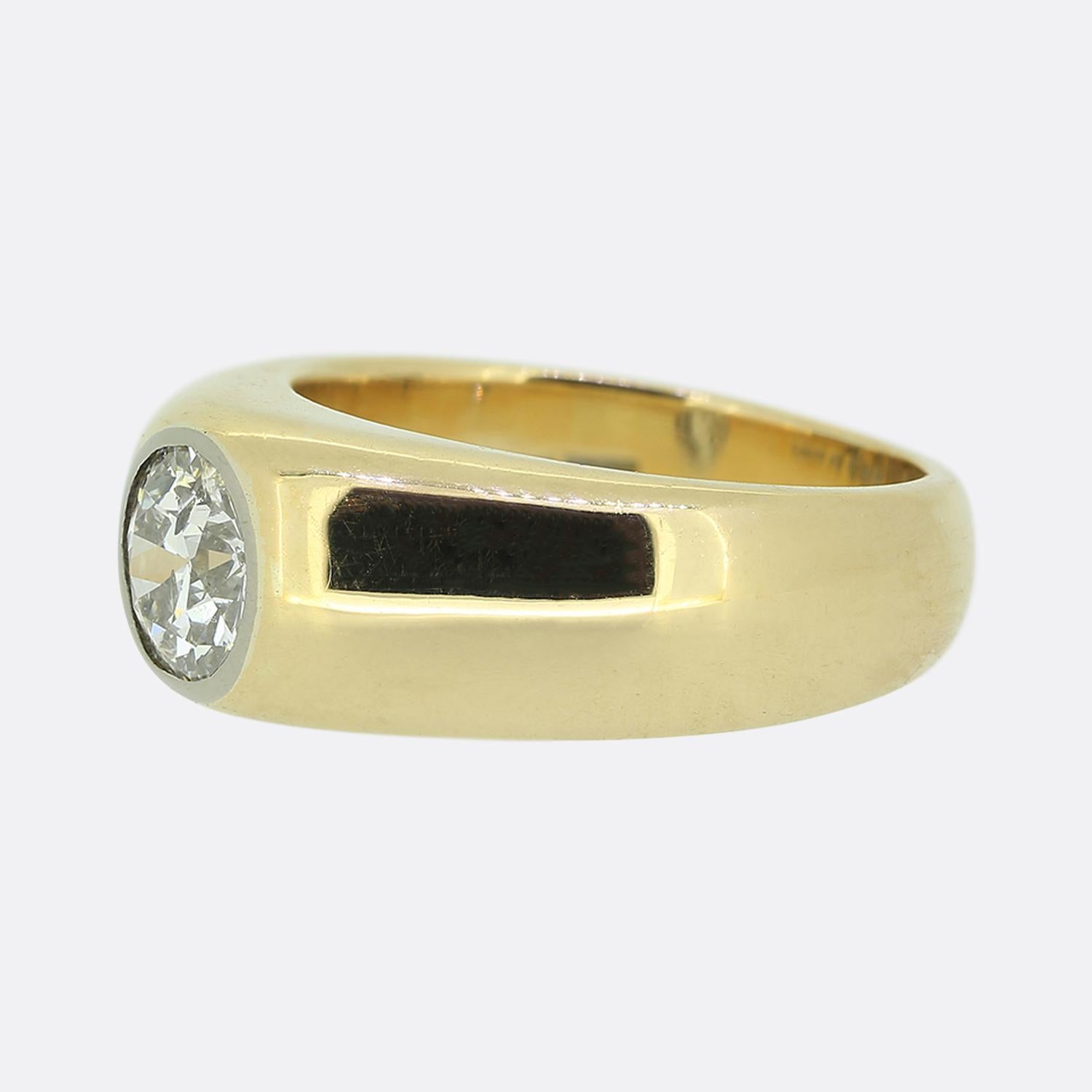 Here we have a classically styled gypsy ring featuring a captivating old European cut diamond. The diamond, with its classic white hue, is securely set in a sleek platinum bezel setting whilst the wide band is crafted from a warm 18ct yellow gold,