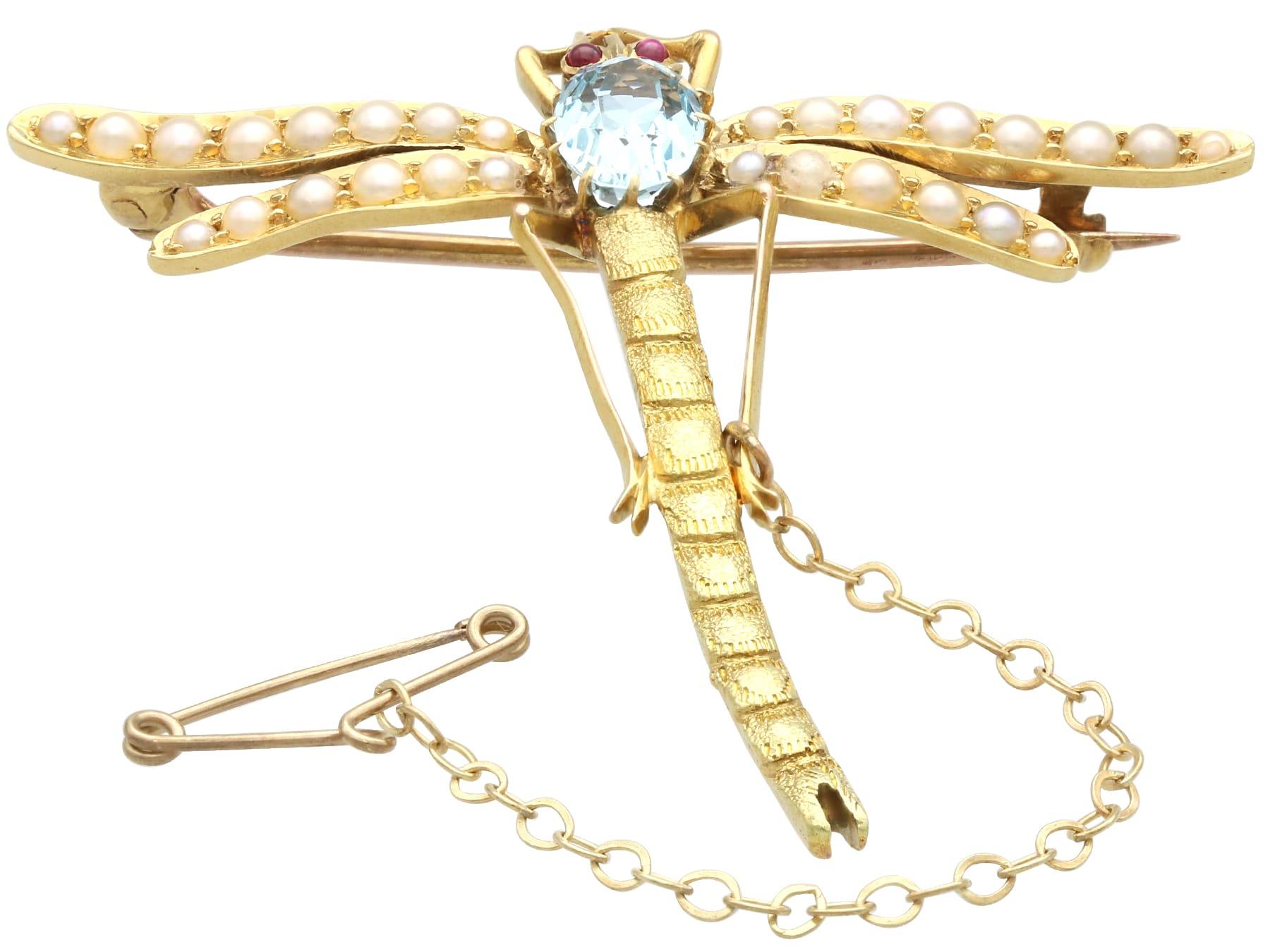 Oval Cut Antique 0.87 Carat Aquamarine Ruby and Pearl Yellow Gold Dragonfly Brooch For Sale