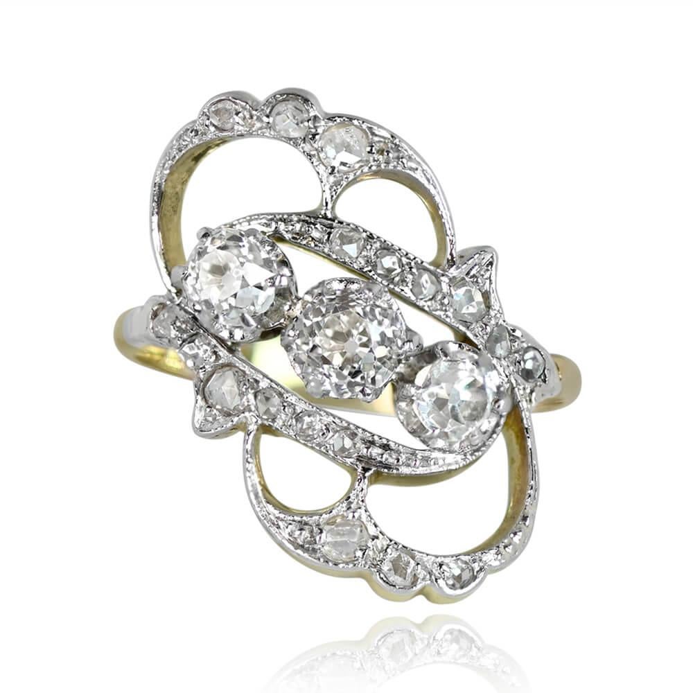 Art Nouveau Diamond Ring: This exquisite antique showcases a trio of old mine-cut diamonds arranged diagonally, boasting a total weight of 0.90 carats. The center stones are embraced by a gracefully swirled open-work design adorned with rose-cut