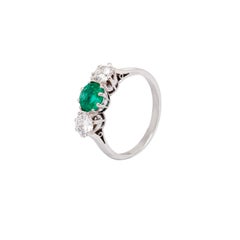 Antique 0.95 Carat Emerald and Diamond Three Stone Platinum Ring