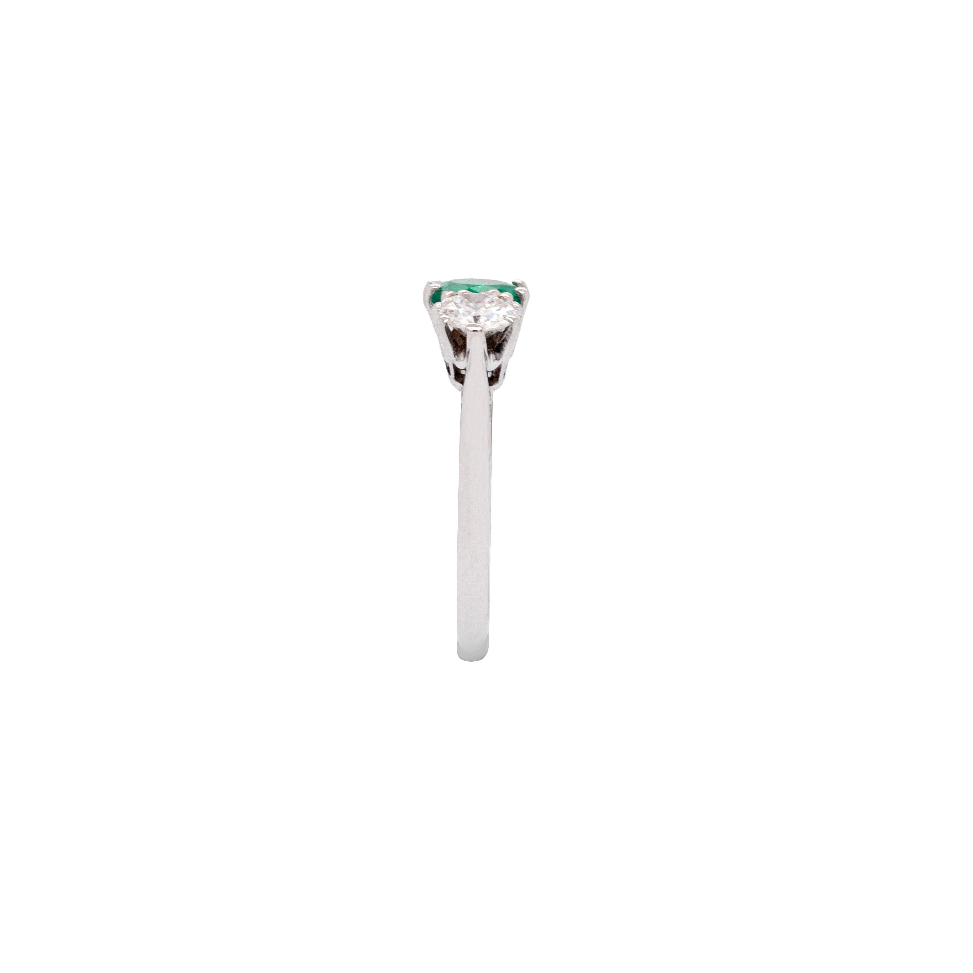 Art Deco Antique 0.95 Carat Emerald and Diamond Three Stone Platinum Ring For Sale