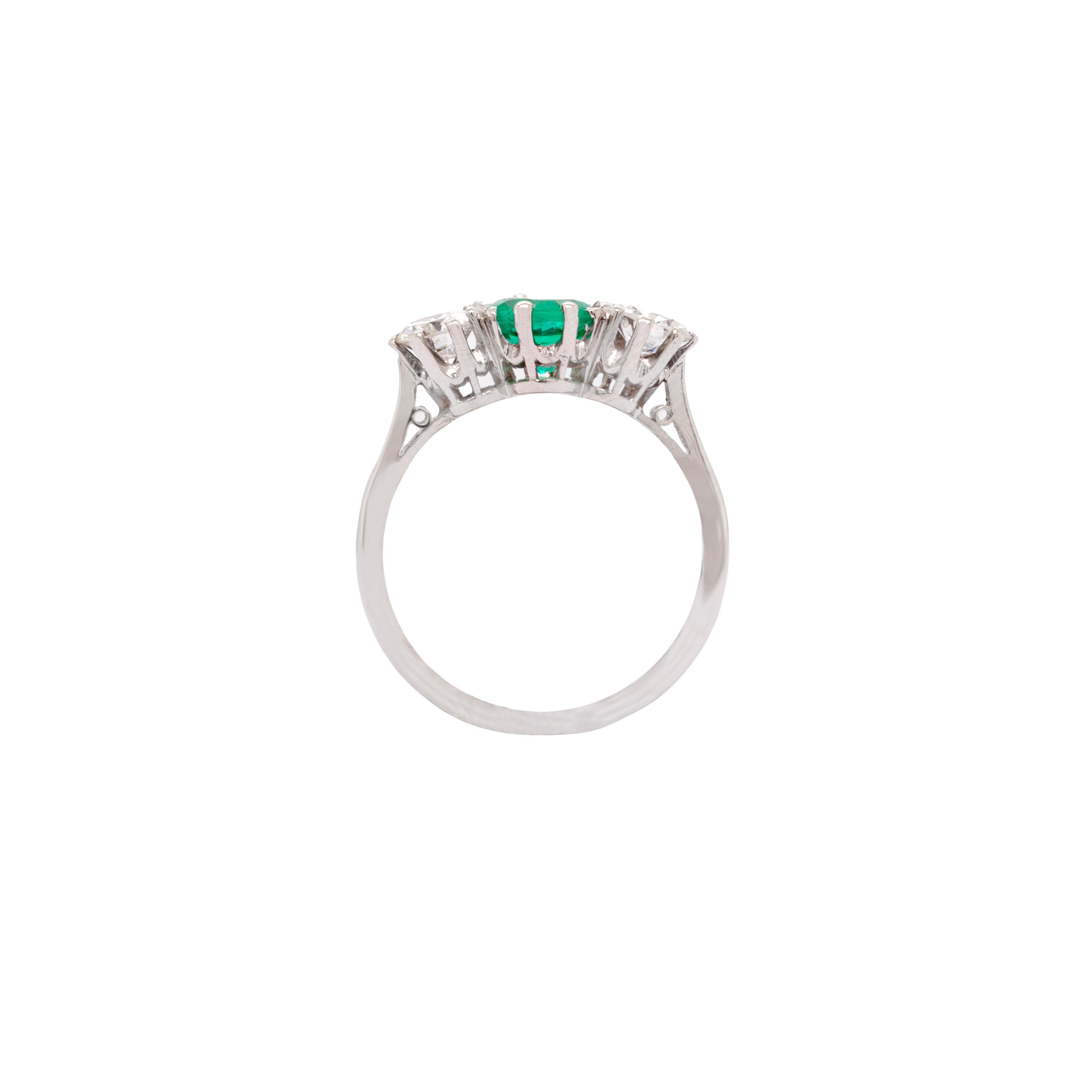 Round Cut Antique 0.95 Carat Emerald and Diamond Three Stone Platinum Ring For Sale