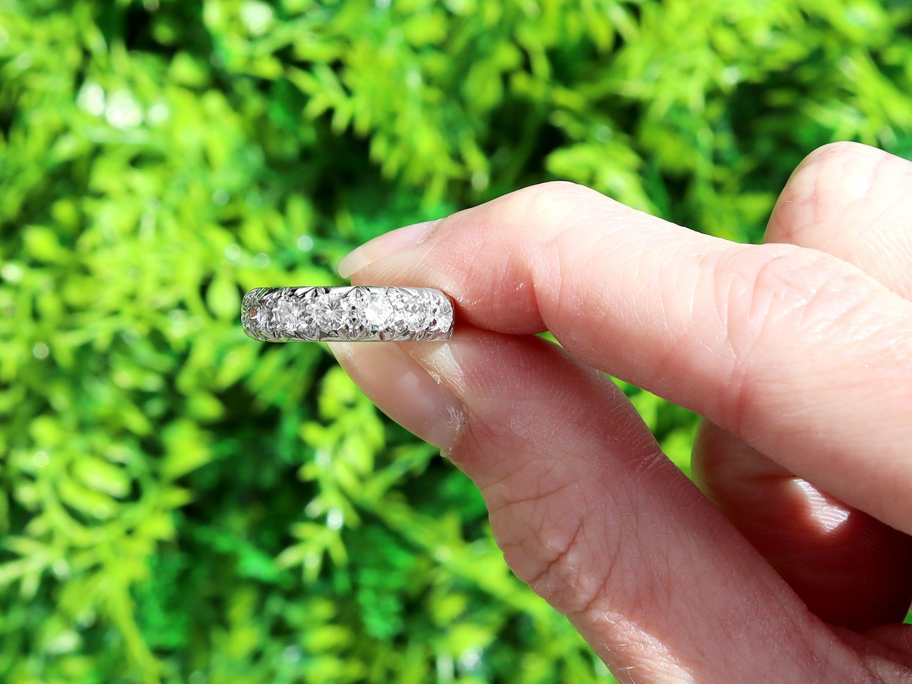 A fine and impressive antique 0.95 carat diamond and 18 karat white gold half eternity ring; part of our diamond eternity rings collection.

This fine and impressive antique diamond eternity ring has been crafted in 18k white gold.

The groove