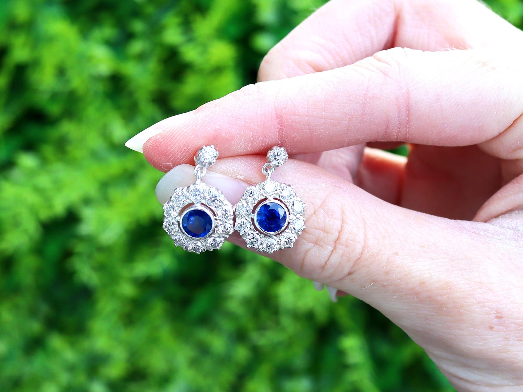 A stunning, fine and impressive pair of antique 1.00 carat blue sapphire and 1.98 carat diamond, 18 karat yellow gold, silver set drop earrings; part of our antique sapphire jewellery and estate jewelry collections

These stunning, fine and