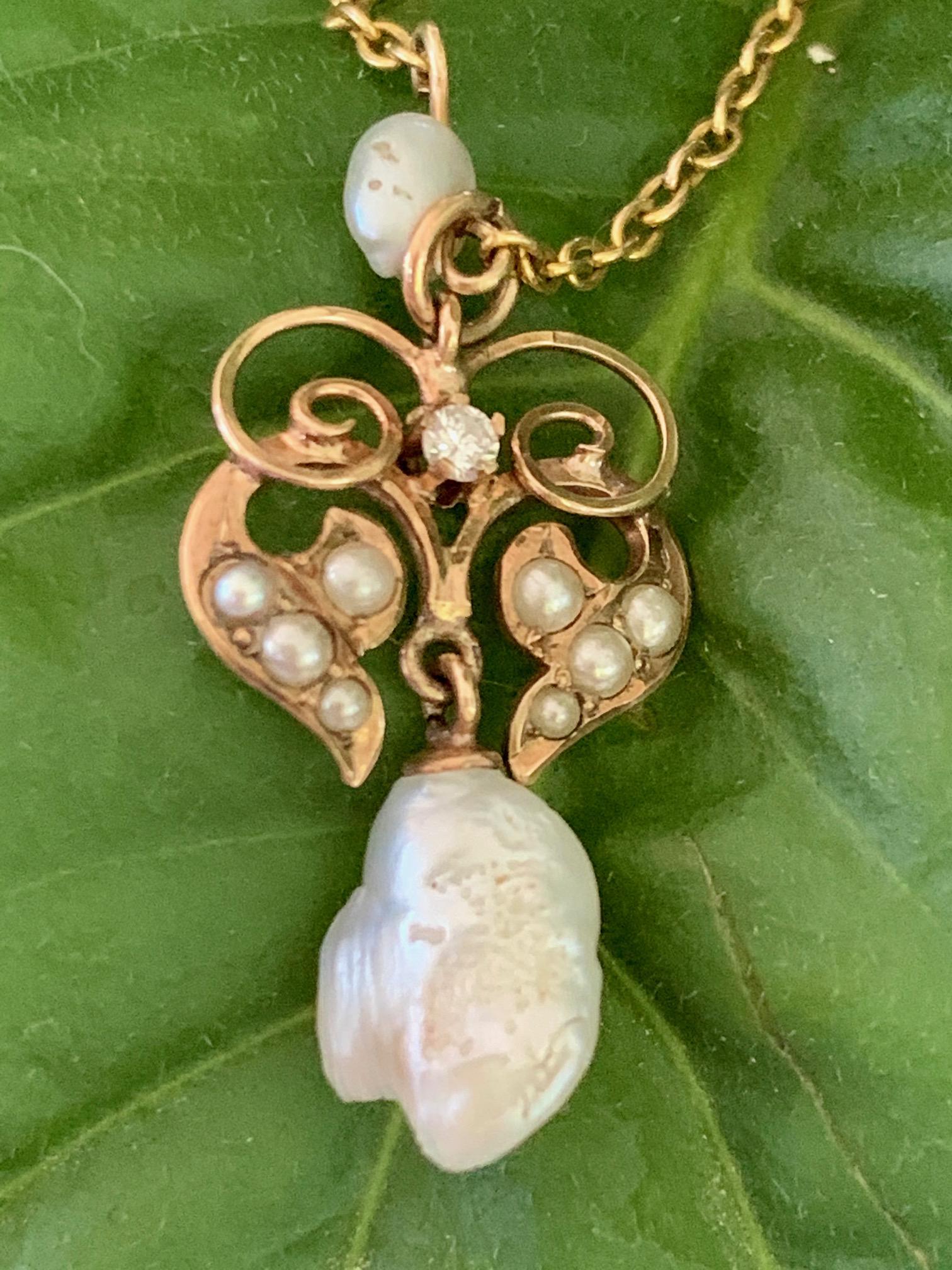 This antique Lavalier features Pearls and Diamonds.  They are set in 14k gold.  

There is no stamp on this piece.

Pendant size: with Pearl drop:  1