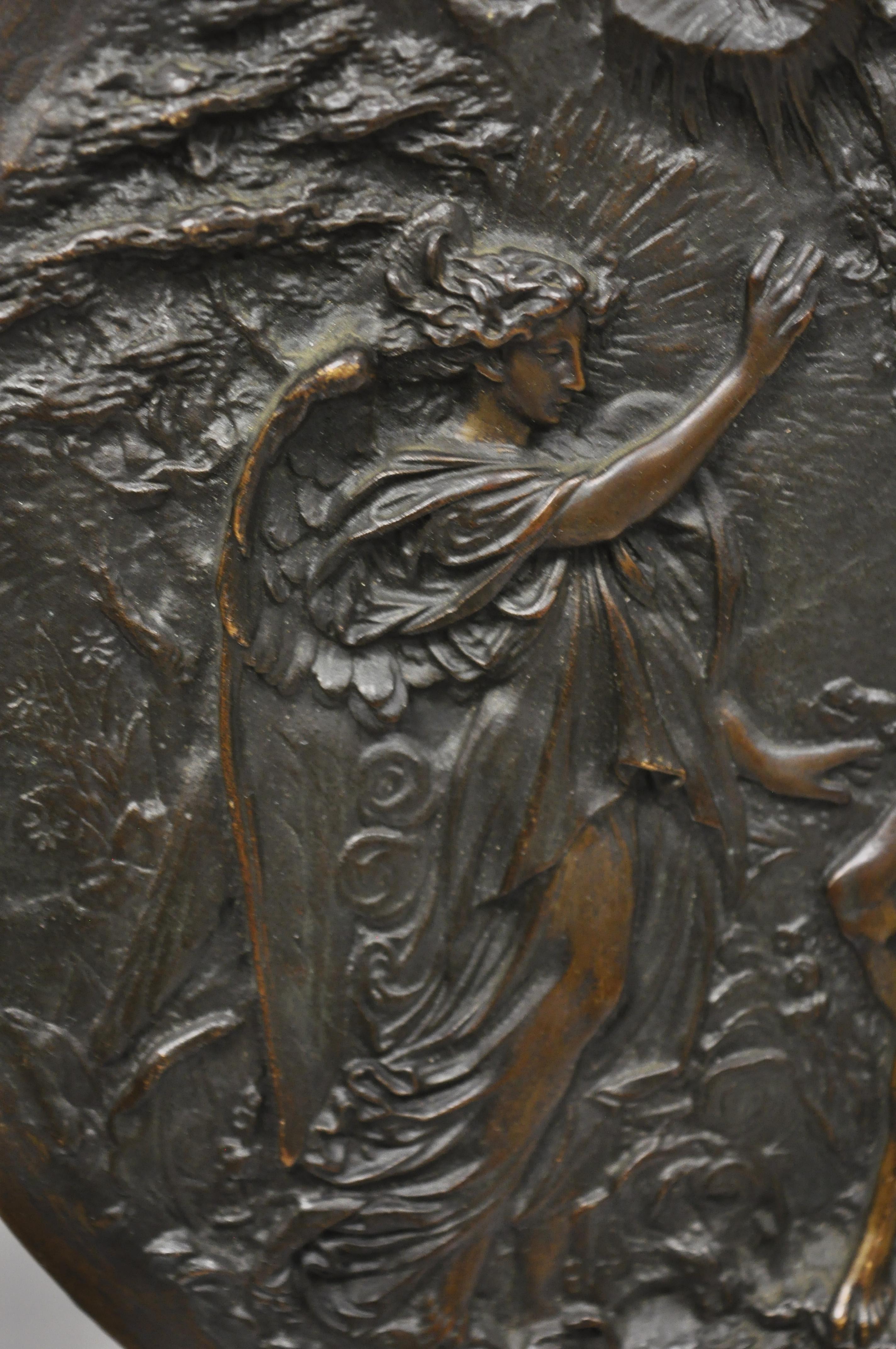 Antique round figural bronze plaque medallion Adam and Eve Garden of Eden. Item features solid cast bronze construction, figure of Expulsion of Adam and Eve with Angel from the Garden of Eden, circa 19th century. Measurements: .5