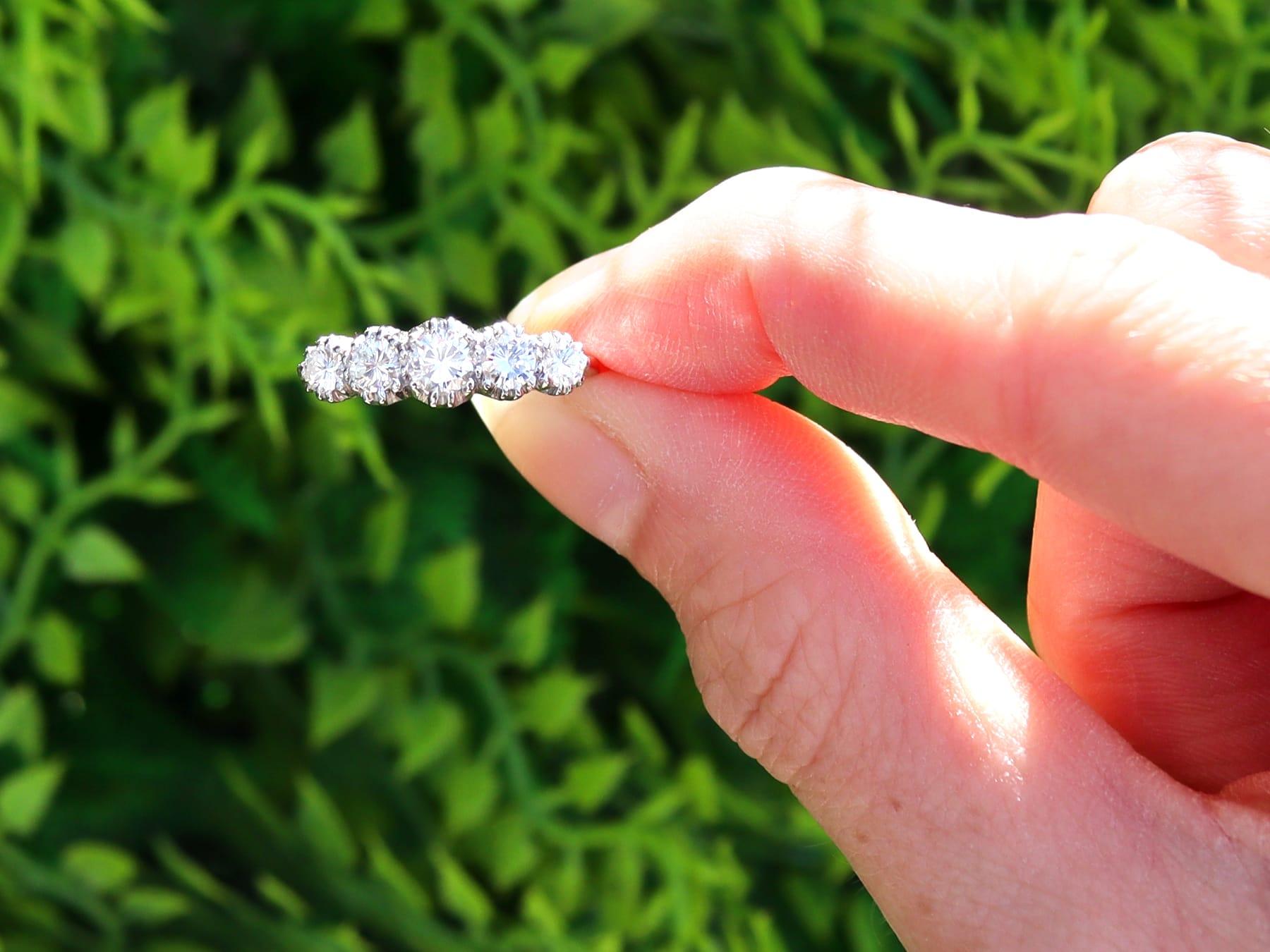 A fine and impressive antique 1.00 carat diamond and 18 karat white gold, platinum set five stone dress ring; part of our diverse antique diamond jewelry and estate jewelry collections.

This fine and impressive five stone diamond ring has been