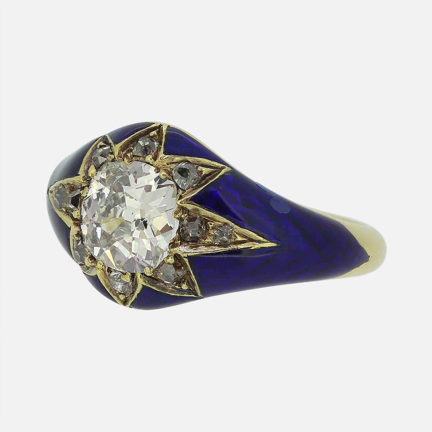 Here we have a captivating single stone ring featuring a centralised round faceted old European cut diamond. This focal diamond is set in a starburst design, surrounded by 10 tiny old mine cut diamonds, all neatly nestled in rich 18ct yellow gold.