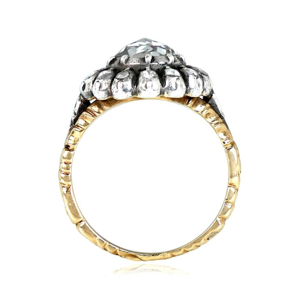 This antique Georgian era ring boasts a 1.00 carat rose cut diamond with J color and VS2 clarity, surrounded by a floral motif of rose cut diamonds. The ring is silver on 18k yellow gold, and the center diamond is backed with hand-engraved detailing