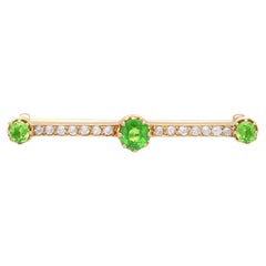 Antiguo Broche de oro rosa con barra de granate demantoide y diamantes de 1,01 quilates