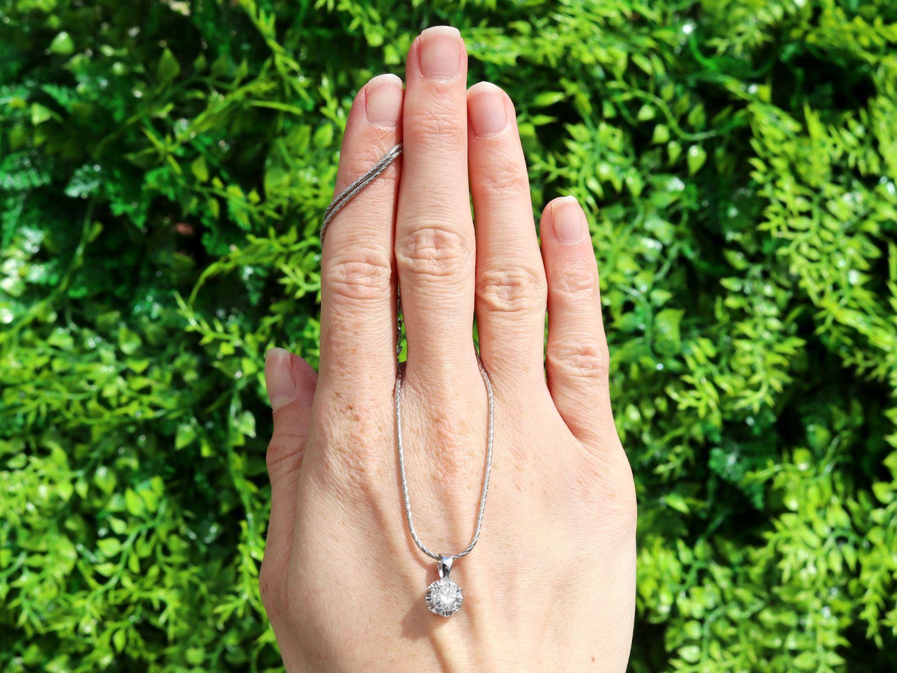 A stunning, fine and impressive antique 1.01 carat diamond and 15 karat white gold pendant; part of our diverse diamond jewellery collections.

This stunning, fine and impressive diamond pendant has been crafted in 15k white gold.

The pierced
