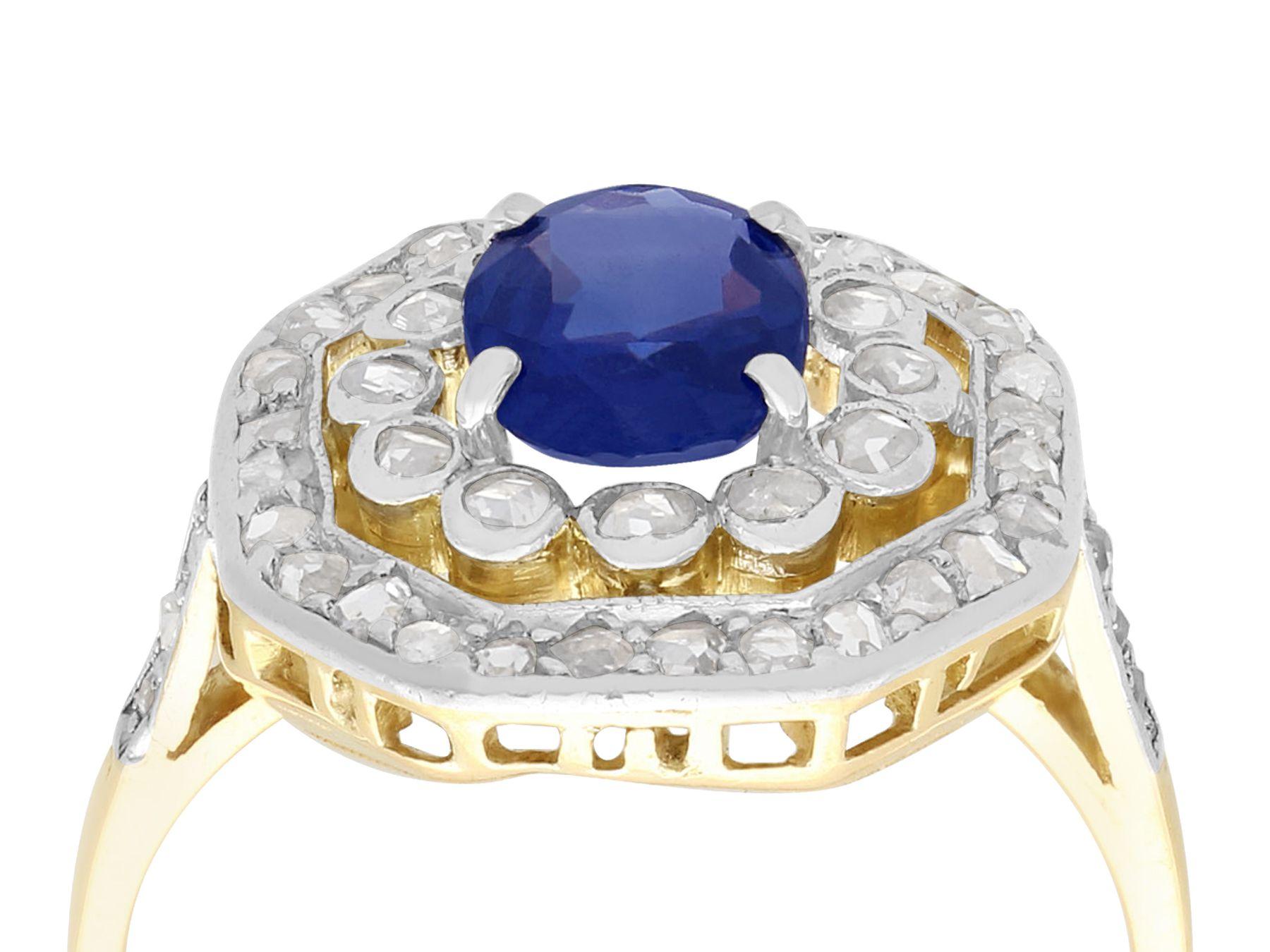 A fine and impressive antique 1.02 carat blue sapphire and 0.62 carat diamond, 10 karat yellow gold and platinum set cluster ring; part of our diverse antique jewelry collections.

This fine and impressive antique Edwardian sapphire and diamond ring